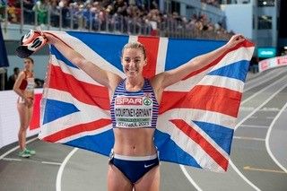 Melissa Courtney-Bryant celebrates winning bronze at the European Indoor Championships.